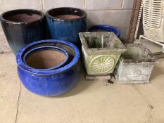 Seven assorted glazed earthenware and reconstituted stone garden planters, largest diameter 40cm,