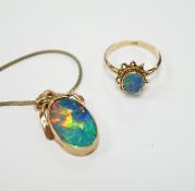 A 9ct and black opal doublet set oval ring, size L and a yellow metal and black opal doublet set