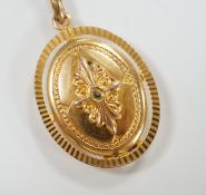 An embossed yellow metal oval pendant locket, 30mm, gross weight 9.6 grams.***CONDITION REPORT***