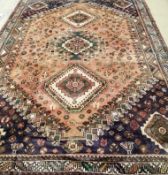 A Shiraz brick red ground carpet, 310 x 218cm***CONDITION REPORT***PLEASE NOTE:- Prospective