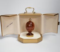 A cased Theo Faberge, (1922-2007) turned bubinga wood Eternity Egg, with Imperial Crown finial, gilt