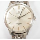 A gentleman's stainless steel Omega Seamaster 30 manual wind wrist watch, on a stainless steel Omega
