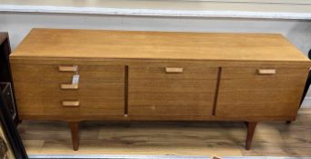 A mid century Scandinavian 'Gyros' teak sideboard, length 180cm, depth 44cm, height 73cm***CONDITION