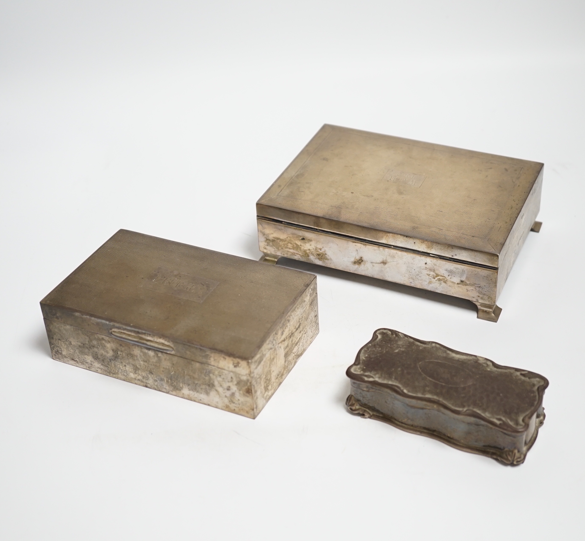 Two engine turned silver mounted cigarette boxes, the largest by Garrard & Co, London, 1955, 16.