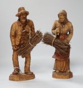A pair of composition peasant figures gathering firewood, tallest 33cm***CONDITION REPORT***PLEASE