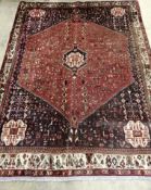 An Abadeh brick red ground carpet, 210 x 155***CONDITION REPORT***PLEASE NOTE:- Prospective buyers
