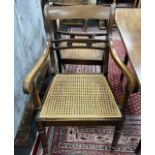 A set of six Regency style mahogany cane seat dining chairs and two later matching elbow chairs with