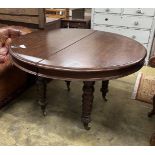 A 19th century and later Continental mahogany circular extending dining table, length approx.