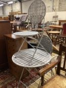 A metal garden table, diameter 72cm, height 75cm and two chairs***CONDITION REPORT***PLEASE NOTE:-