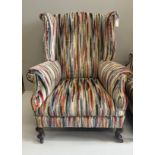 A pair of Edwardian wing armchairs, upholstered in contemporary striped fabric, width 74cm, depth