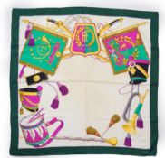 A Celine 18th Regiment silk scarf, multi-coloured with ivory back ground and green border, approx