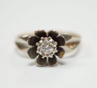An 18ct gold and illusion set diamond flower head ring, size L, gross weight 4.7 grams.***