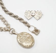 A Victorian white metal chains with a locket, a white metal bracelet and a sterling double heart