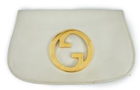 A vintage Gucci Blondie Unicorn white leather clutch bag, gold Gucci front logo, weighted closure,