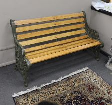 A Victorian Coalbrookdale 'nasturtium' pattern cast iron garden bench restored with later oak slats,