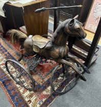 A Victorian style horse tricycle, height 84cm***CONDITION REPORT***PLEASE NOTE:- Prospective