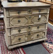 An 18th century geometric moulded oak chest of drawers, width 98cm, depth 57cm, height 92cm***