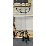A pair of wrought iron three branch tripod pricket candlestands, height 146cm together with a