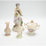 A late 19th century Continental porcelain figure of a lady, a Pinxton-type chocolate cup and