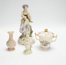 A late 19th century Continental porcelain figure of a lady, a Pinxton-type chocolate cup and