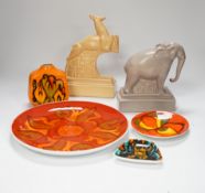 Four Poole Pottery Delphis items including a small vase, a plate, etc. and two animals stamped