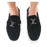 A pair of Louis Vuitton black suede Monte Carlo loafers, size 41, crafted from black suede and the