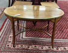 An Edwardian Schoolbred & Co. oval banded rosewood low occasional table converted from an etagere,