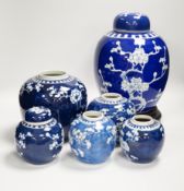 Six Chinese blue and white prunus jars two with covers, tallest 33cm including wooden vase stand***