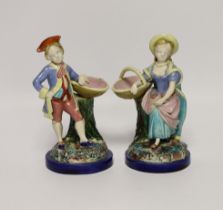 A pair of 19th century Worcester majolica figures holding baskets, largest 17cm high***CONDITION