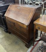 A George III oak bureau the interior with well, width 92cm, depth 53cm, height 101cm***CONDITION