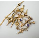 A small collection of fifteen assorted mainly 19th century yellow metal or gold plated watch keys