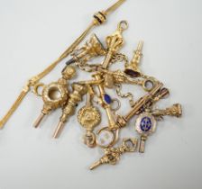 A small collection of fifteen assorted mainly 19th century yellow metal or gold plated watch keys