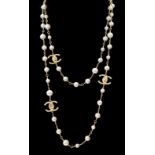 A Chanel gold plated 3 CC scatter pearl long necklace as seen in the film The Devil Wears Prada worn