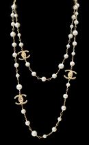 A Chanel gold plated 3 CC scatter pearl long necklace as seen in the film The Devil Wears Prada worn