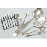 A pair of sterling pepperettes, five other sterling or 800 standard items of flatware and a quantity