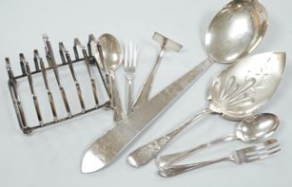 A pair of sterling pepperettes, five other sterling or 800 standard items of flatware and a quantity