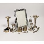 Sundry small silver including a pair of dwarf candlesticks, condiments, napkin ring, spill vases and