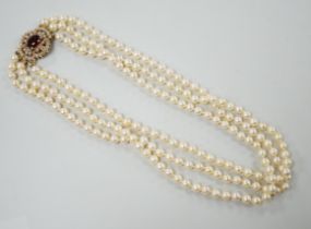 A 1960's triple strand cultured pearl choker necklace by Cropp & Farr, with 9ct gold, garnet and
