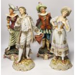 A pair of Volkstedt porcelain figures and a pair continental earthenware figures, 42cm***CONDITION