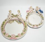 Two late 19th century German oval porcelain oval figurative mirrors, 33cm high***CONDITION