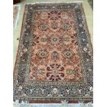 A North West Persian red ground rug, 220 x 137cm***CONDITION REPORT***PLEASE NOTE:- Prospective