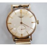 A gentleman's 9ct. gold Longines manual wind wrist watch, with engraved inscription, on an