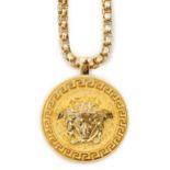 A Versace Medusa gold Greca medallion coin pendant with chunky rapper necklace, in original white
