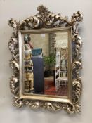 A Florentine style silvered composition wall mirror, width 90cm, height 120cm***CONDITION REPORT***