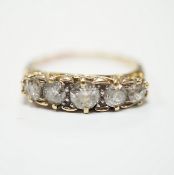 A yellow metal and graduated five stone diamond set half hoop ring, size Q, gross weight 3.9