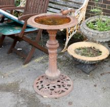 A cast metal circular bird bath, diameter 47cm, height 80cm