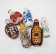 Four Chinese overlaid glass snuff bottles and two Chinese porcelain snuff bottles, three with