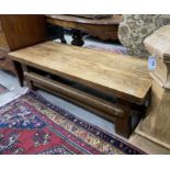 A rectangular rustic style oak coffee table width 137cm, depth 57cm, height 45cm.