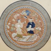 A 20th century Chinese framed embroidered figurative silk circular panel with a brocade border