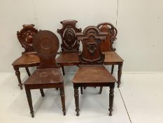 Four Victorian mahogany hall chairs and a Regency hall chair